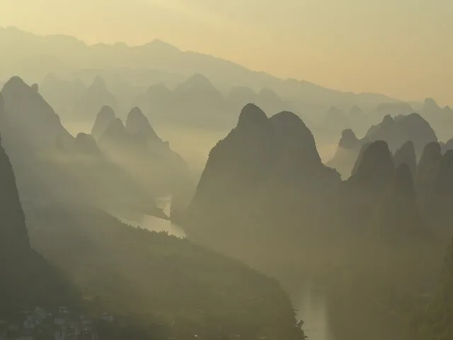 Misty morning view of karst mountains and the winding Li River valley